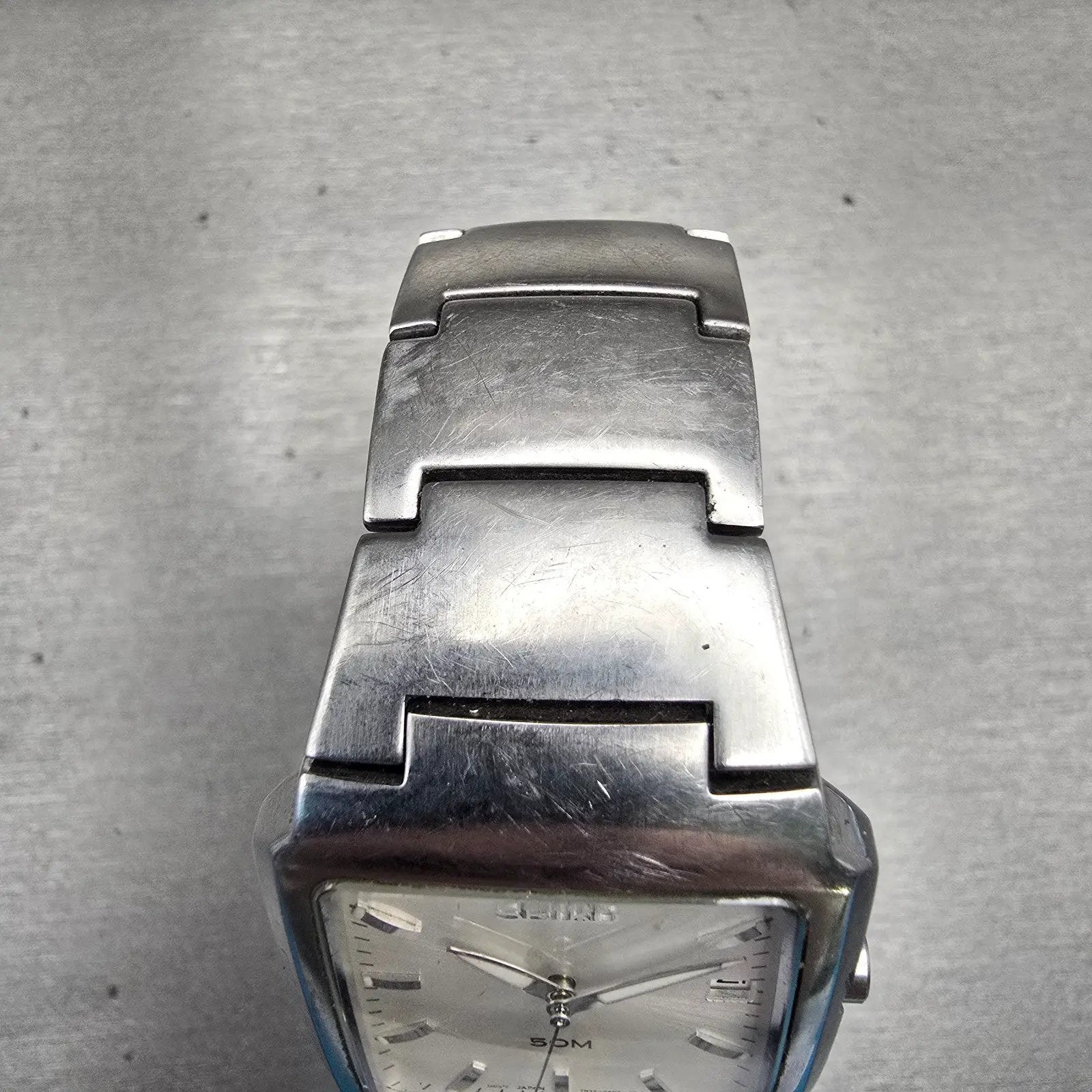 Seiko Watch Men 32mm Silver Dial Silver Tone Date Rectangle 7N32-0AL0 New Batt D4
