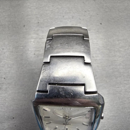 Seiko Watch Men 32mm Silver Dial Silver Tone Date Rectangle 7N32-0AL0 New Batt D4