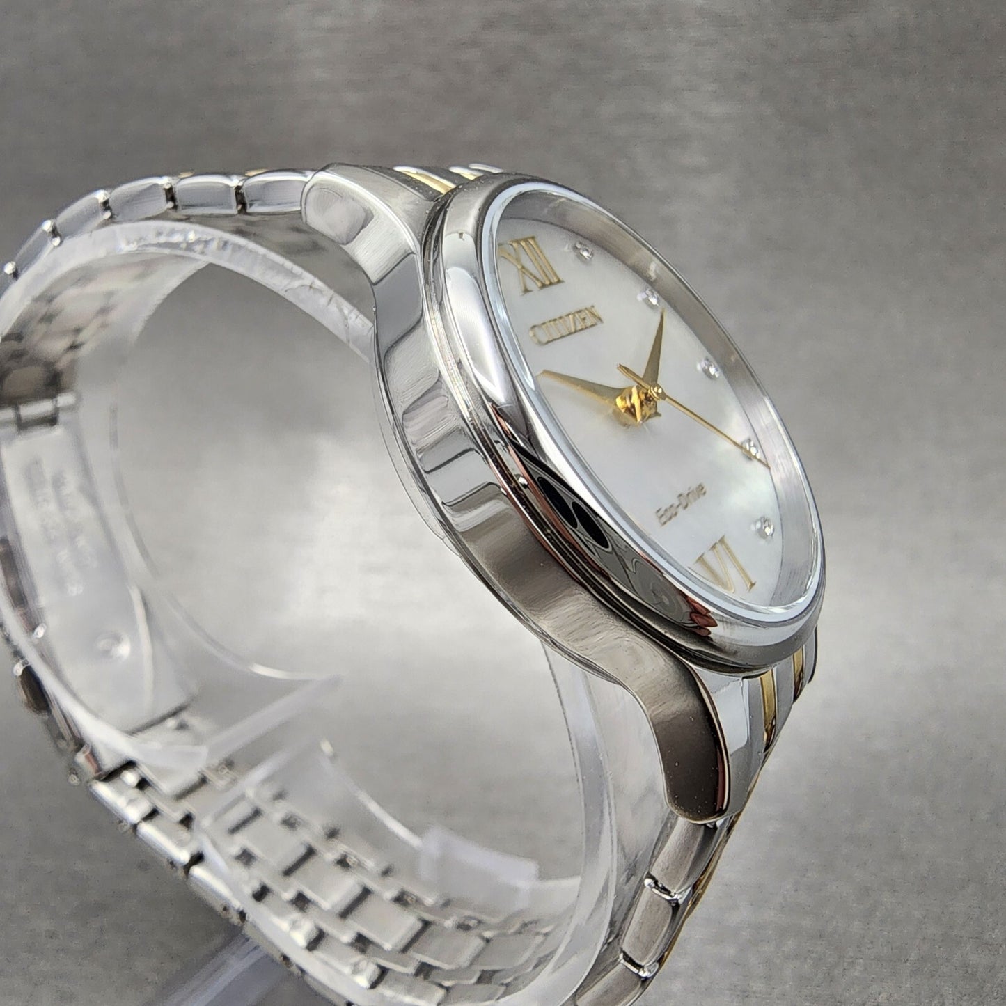 Citizen Eco-Drive Watch Women 31mm MOP Dial Two Tone Crystal Markers EM0894-50D