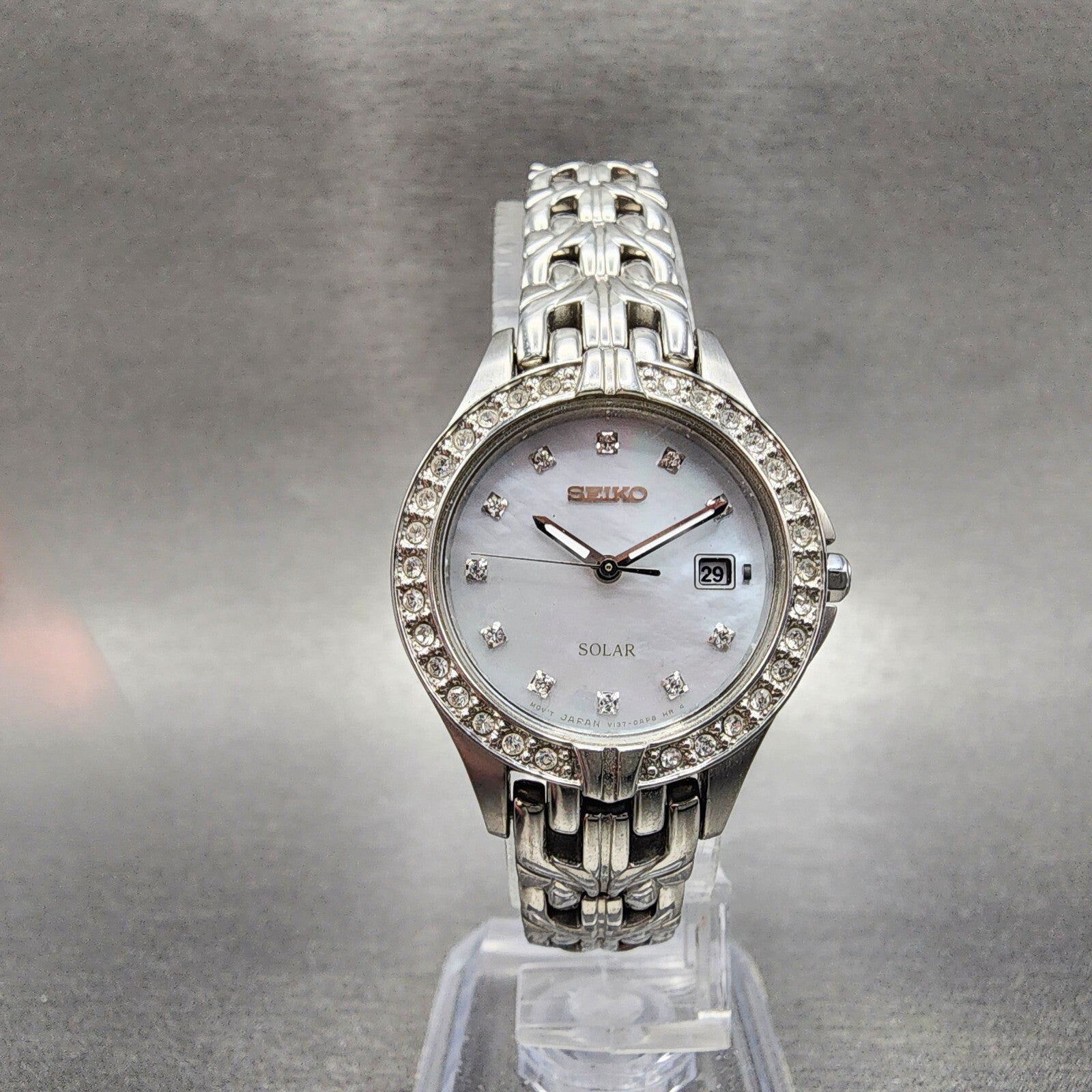 Seiko Solar Watch Women 27mm MOP Dial Steel Date Round Crystal Bezel Runs5