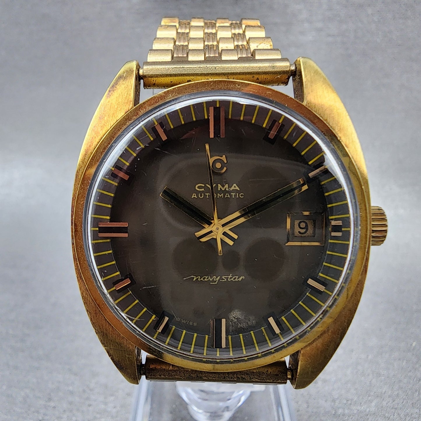 Cyma Navy Star Watch Men 35mm Brown Dial Gold Tone Date Automatic Cushion Runs