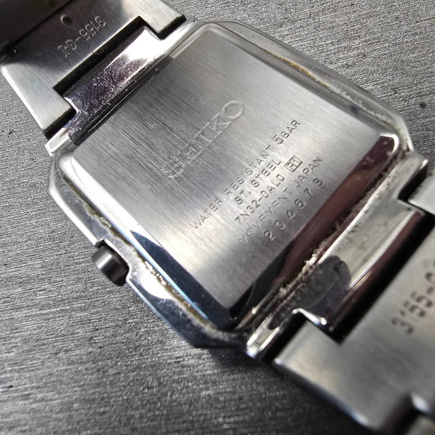 Seiko Watch Men 32mm Silver Dial Silver Tone Date Rectangle 7N32-0AL0 New Batt D10