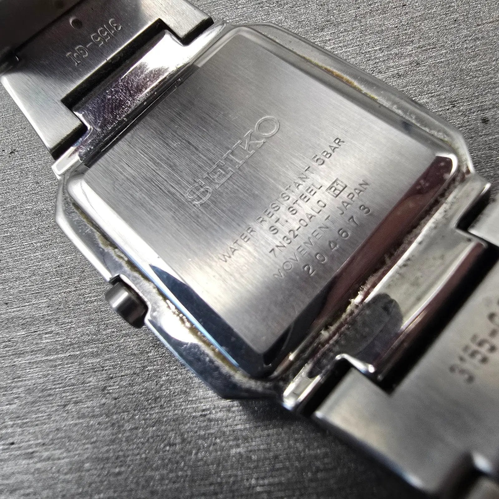Seiko Watch Men 32mm Silver Dial Silver Tone Date Rectangle 7N32-0AL0 New Batt D10