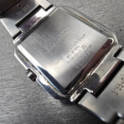 Seiko Watch Men 32mm Silver Dial Silver Tone Date Rectangle 7N32-0AL0 New Batt D10