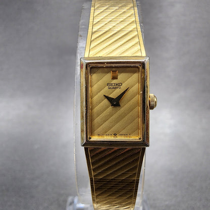 Seiko Tank Watch Women 12mm Gold Dial Gold Tone 1E205109 Rectangle New Battery0