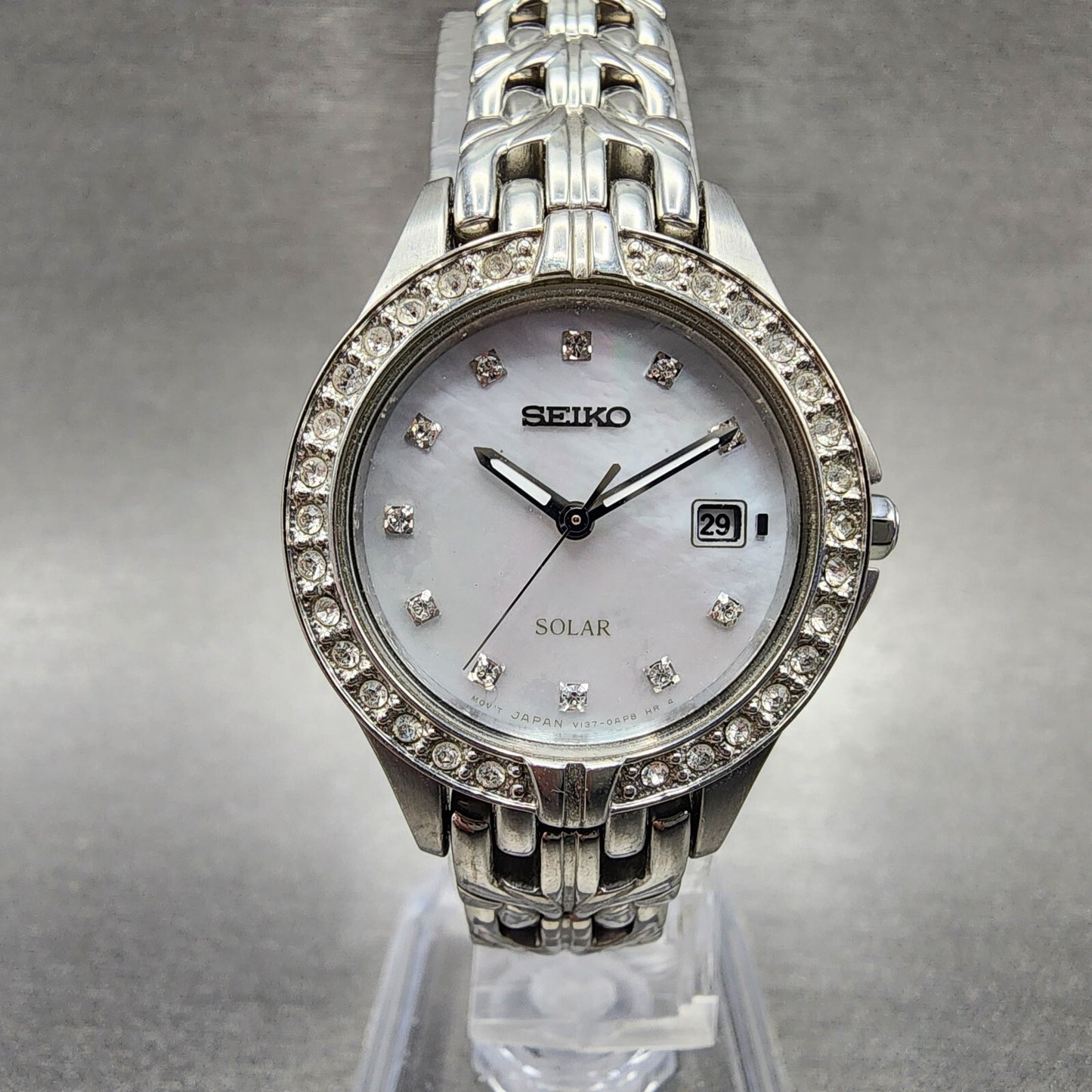 Seiko Solar Watch Women 27mm MOP Dial Steel Date Round Crystal Bezel Runs0