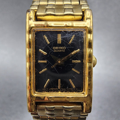 Seiko Tank Watch Women 16mm Black Dial Gold Tone Rectangle 1N015A69 New Battery1