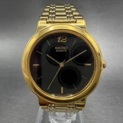 Seiko Watch Men 33mm Black Dial Gold Tone Round Vintage V701-1T79 PARTS0