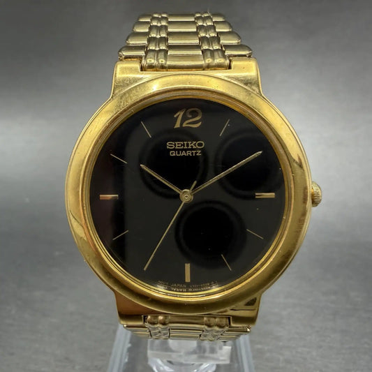 Seiko Watch Men 33mm Black Dial Gold Tone Round Vintage V701-1T79 PARTS0