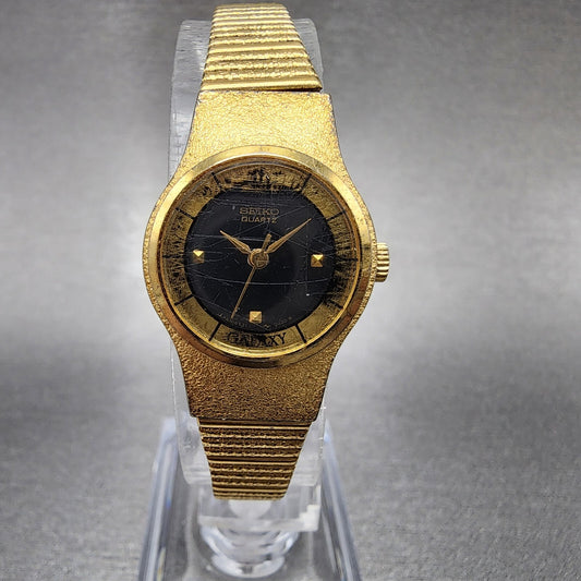VTG Seiko Galaxy Watch Women 20mm Black Dial Gold Tone Round 8Y21-0030 New Batt