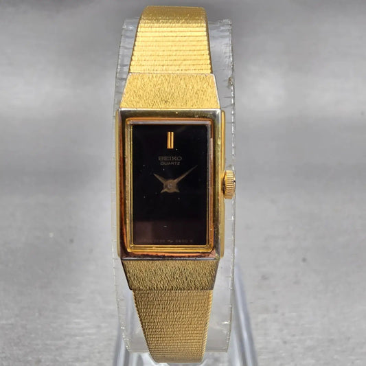 Seiko Tank Watch Women 12mm Black Dial Gold Tone Rectangle 2E20-5490 New Battery0