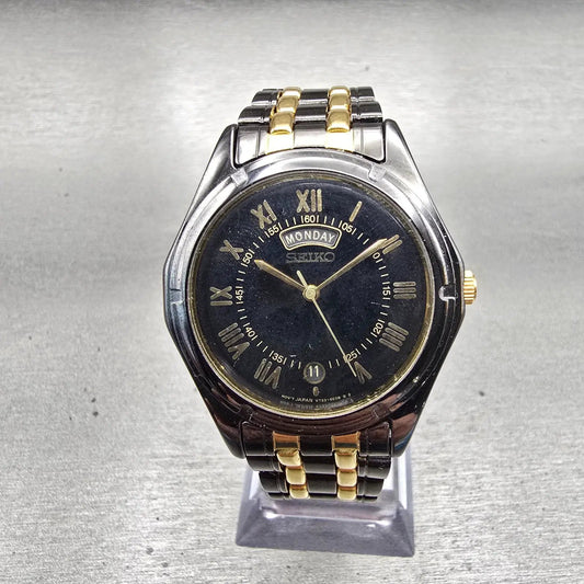 Seiko Watch Men 35mm Black Dial Black & Gold Tone Daydate Round V733-6C49 NewBat0