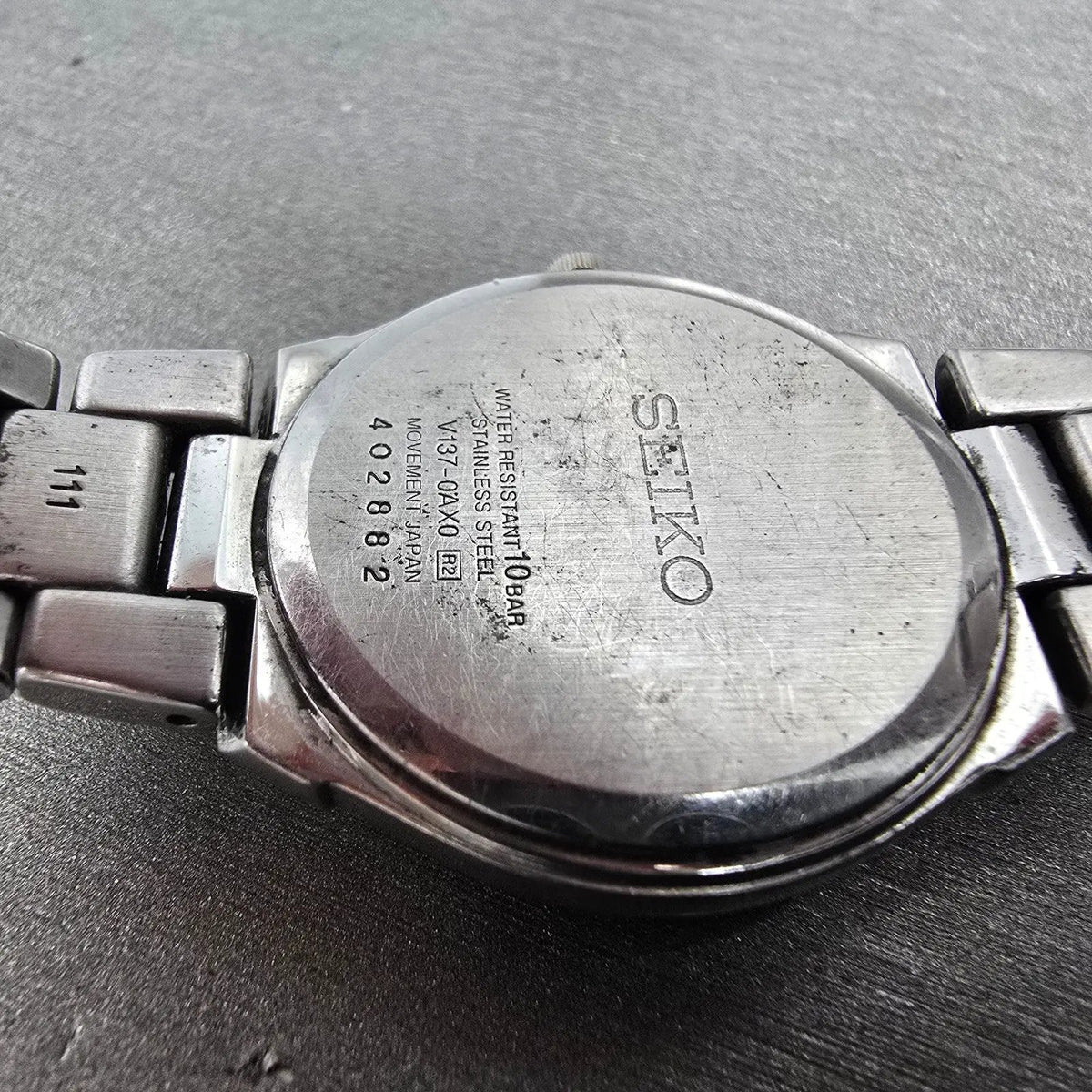 Seiko Solar Watch Women 30mm White Dial Two Tone Date Round V137-0AX0 Runs JP9
