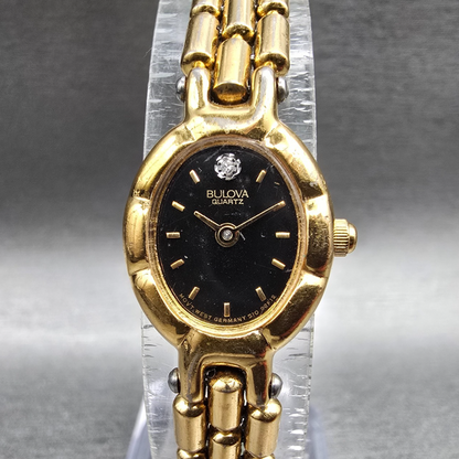 Bulova Watch Women 16mm Black Dial Gold Tone Oval 92F12 New Battery Diamonds VTG0