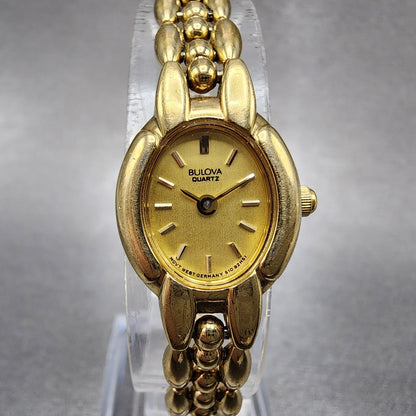 Bulova Watch Women 17mm Champagne Dial Gold Tone Oval 92H51 New Battery0