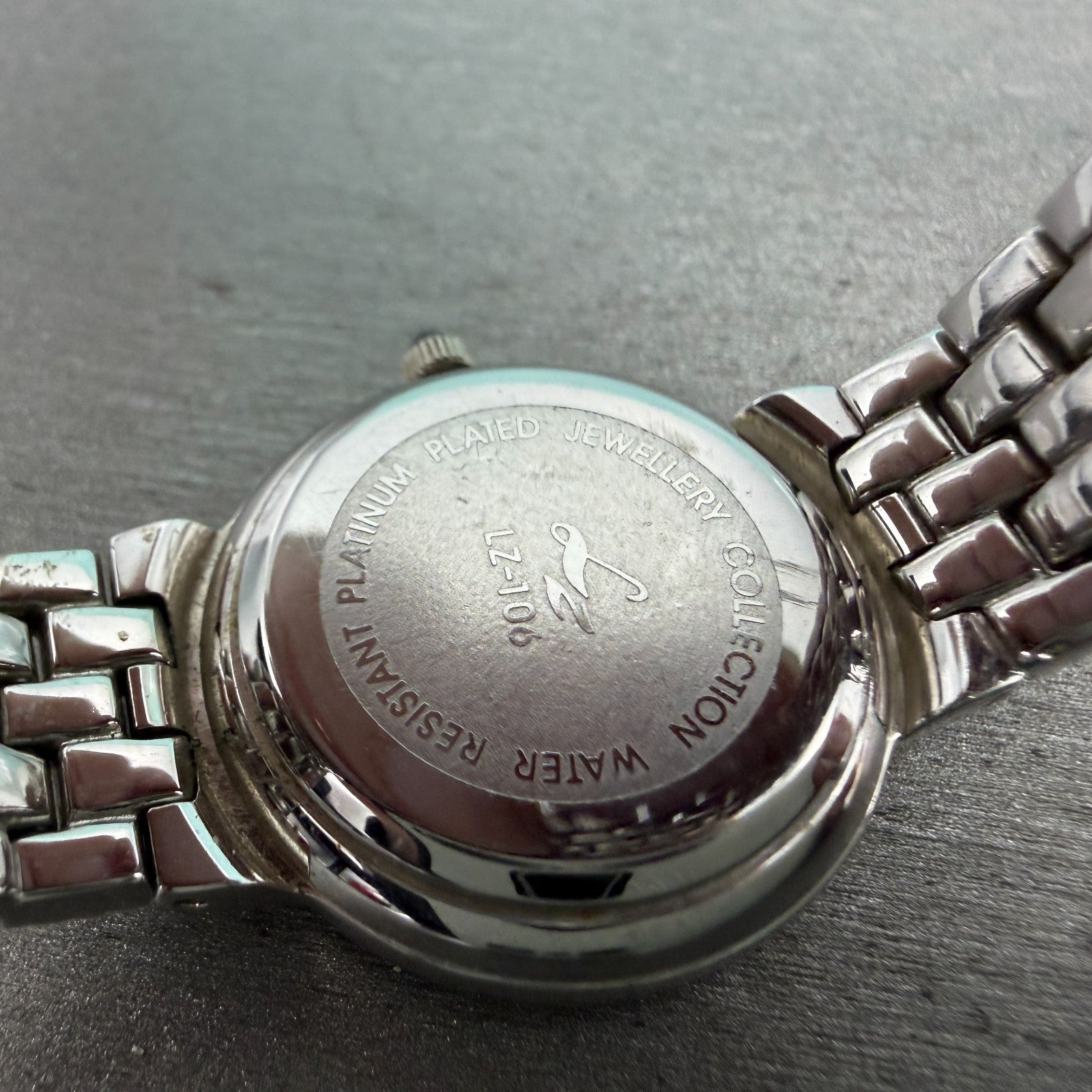 LZ Watch Women 25mm White Dial Silver Tone Ruby Bezel Round New Battery9