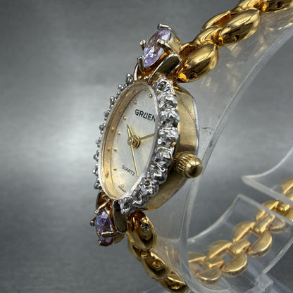Gruen Watch Women 18mm White Dial Gold Tone Oval Pink Gem Stones New Battery ABC2