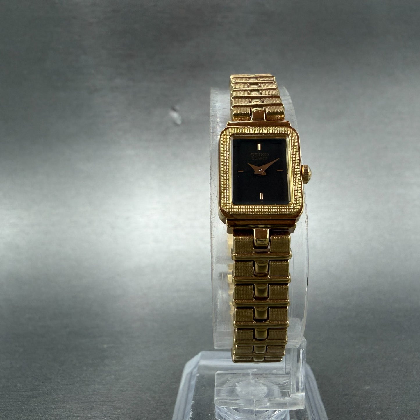 Seiko Watch Women 13mm Black Dial Gold Tone Rectangle 1E20-5689 New Battery NOS5