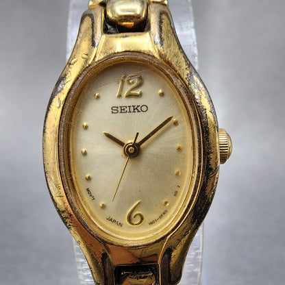 Seiko Watch Women 17mm Champagne Dial Gold Tone Oval 1N010CS0 New Battery1