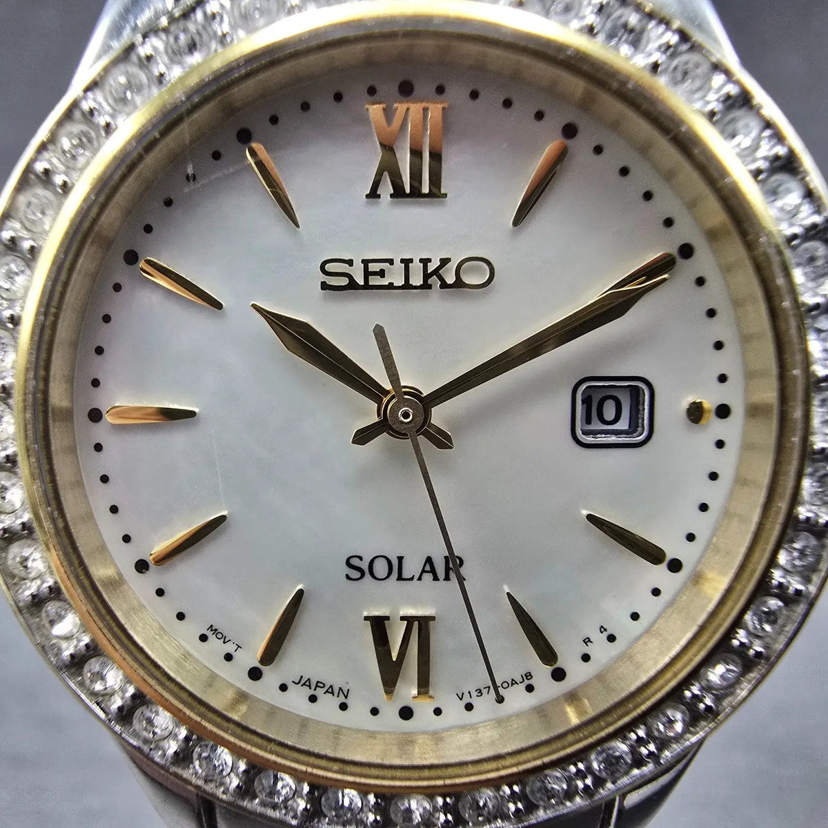 Seiko Solar Watch Women 28mm MOP Dial Two Tone Date Gemmed V137-0AA0 Works JP 871
