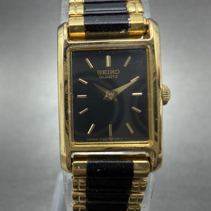 Seiko Tank Watch Women 14mm Black Dial Gold Tone Rectangle 1F20-5A69 New Batt TH1