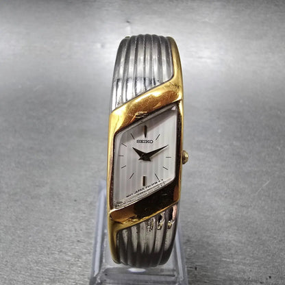 Seiko  Watch Women 15mm White Dial Two Tone Rectangle Bangle 1f20-6f60 New Batt0