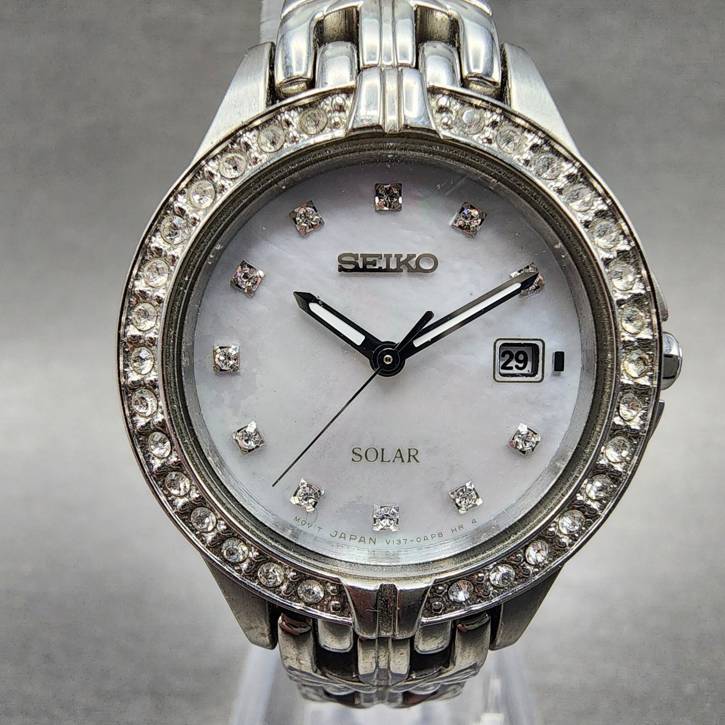 Seiko Solar Watch Women 27mm MOP Dial Steel Date Round Crystal Bezel Runs1