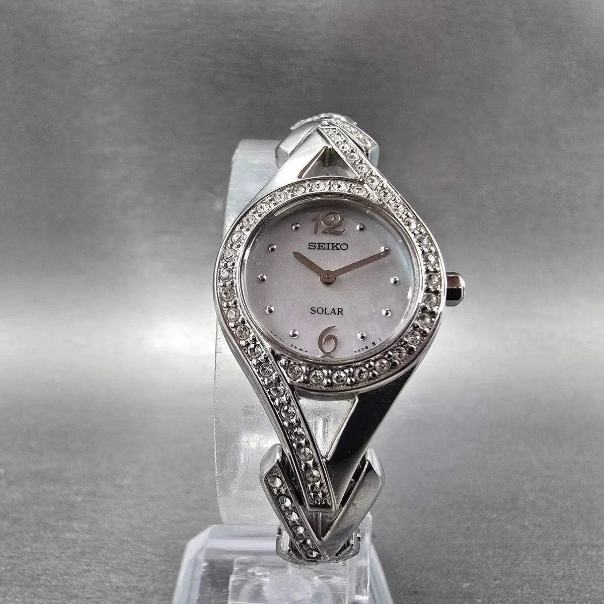 Seiko Solar Watch Women 23mm MOP Dial Silver Tone Round Crystal Bezel Runs5