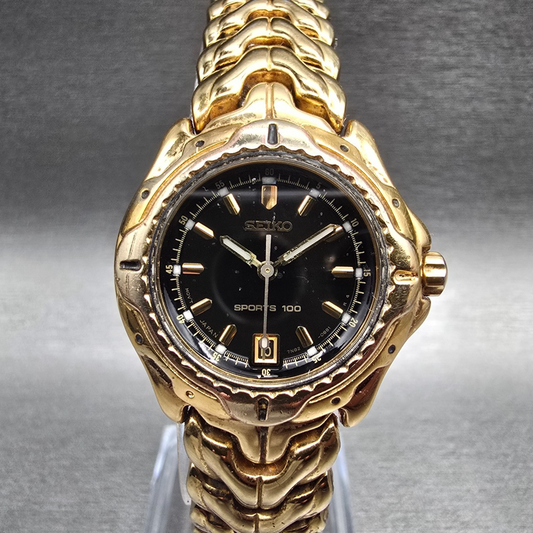 Seiko Sports 100 Watch Women 27mm Black Dial Gold Tone Date 7N82-0379 New Batt0