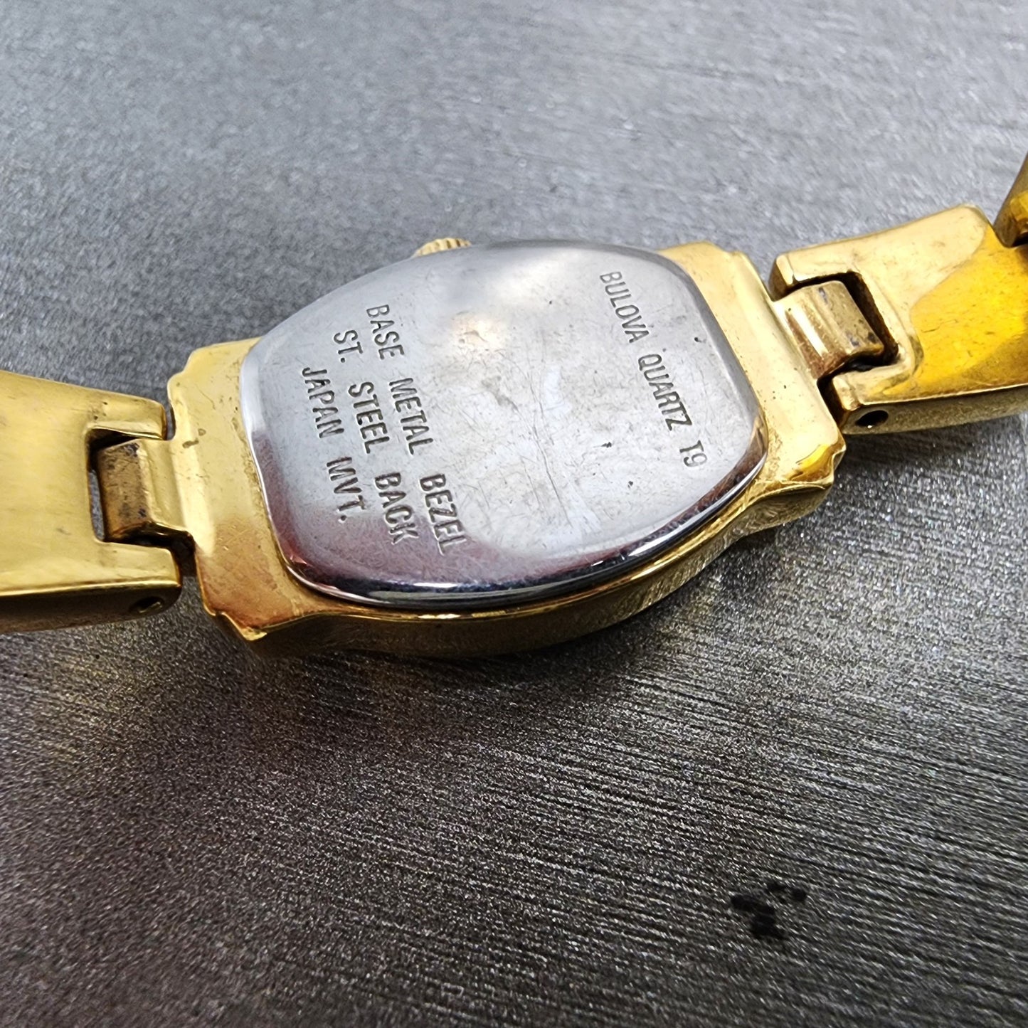 Bulova Watch Women 15mm White Dial Gold Tone Rectangle 97S44 New Battery9