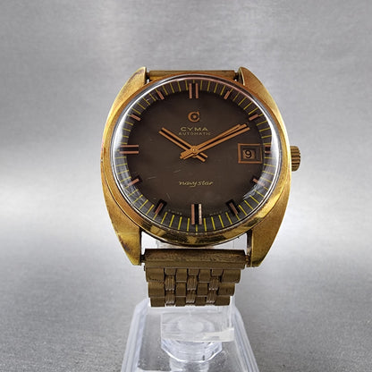 Cyma Navy Star Watch Men 35mm Brown Dial Gold Tone Date Automatic Cushion Runs