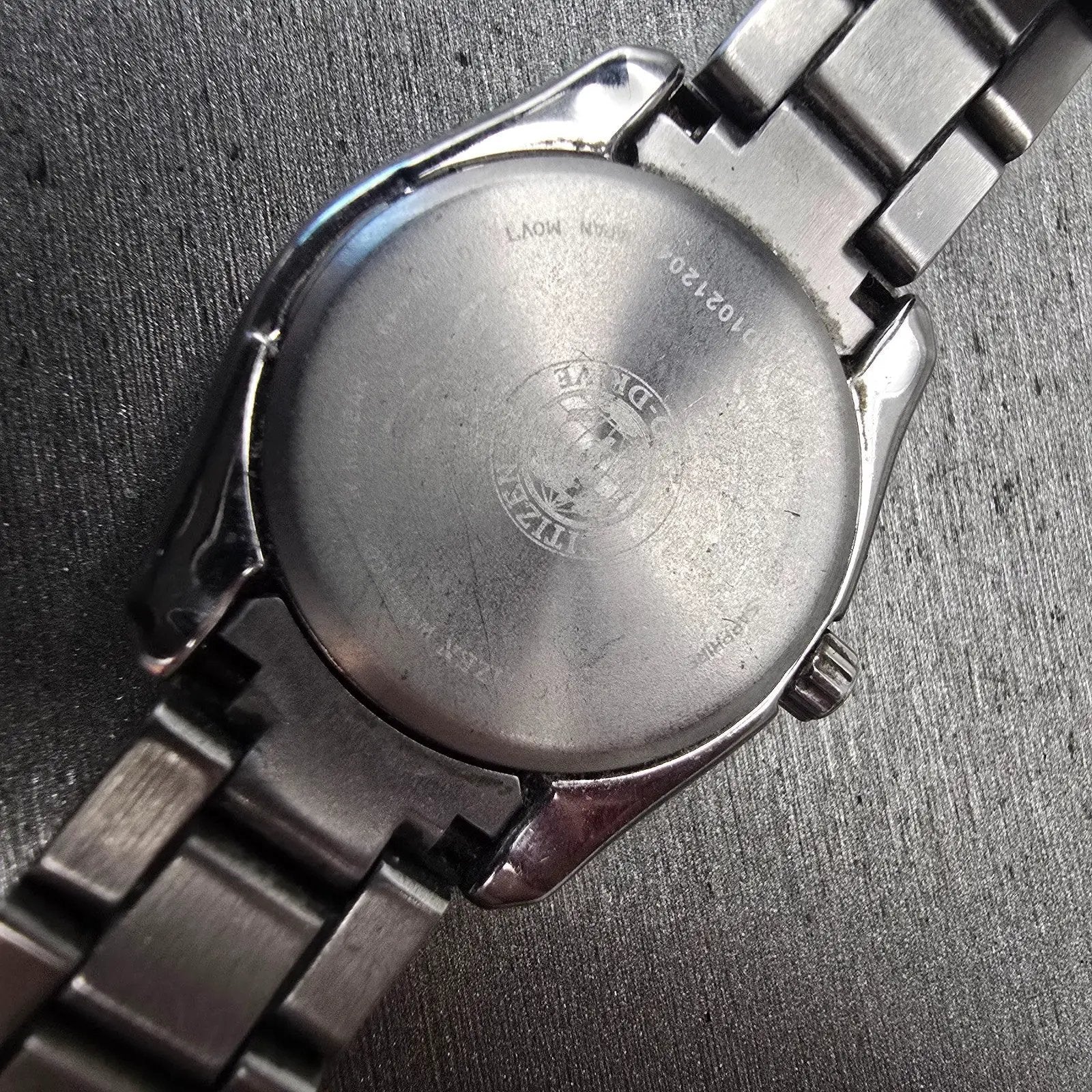 Citizen Eco-Drive Watch Women 27mm Black Dial Titanium Date E011-S068479 Runs10