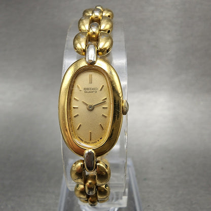 Seiko Watch Women 13mm Champagne Dial Gold Tone Oval 2e206160 New Battery0