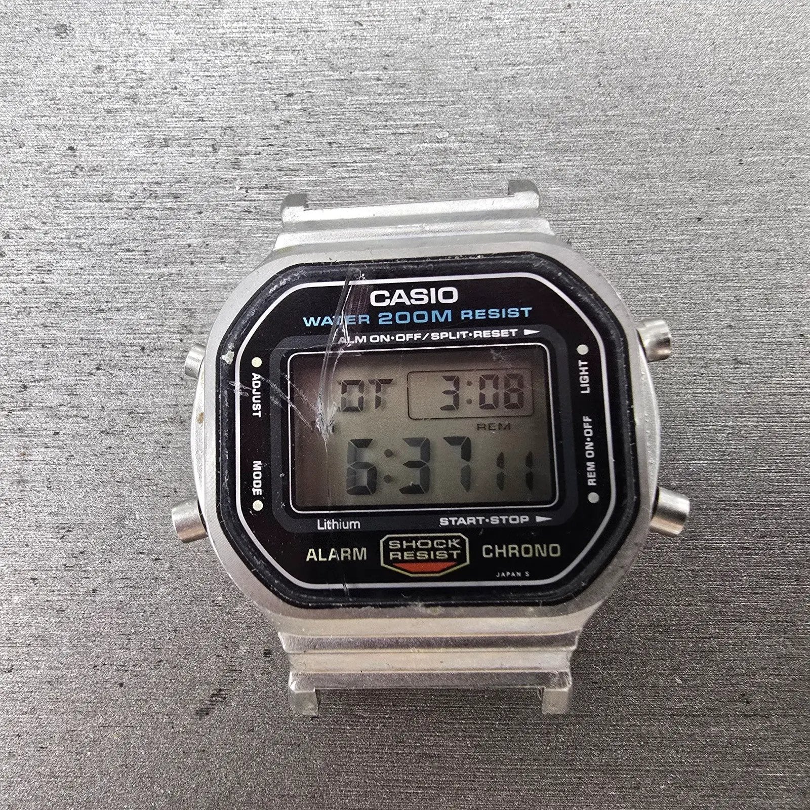 Casio DW-5600 Watch Men 38mm Silver Digital Alarm Chrono 691 New Battery CRACKED0