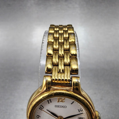 Seiko Watch Women 23mm White Dial Gold Tone Date Round 7N820228 New Battery B124