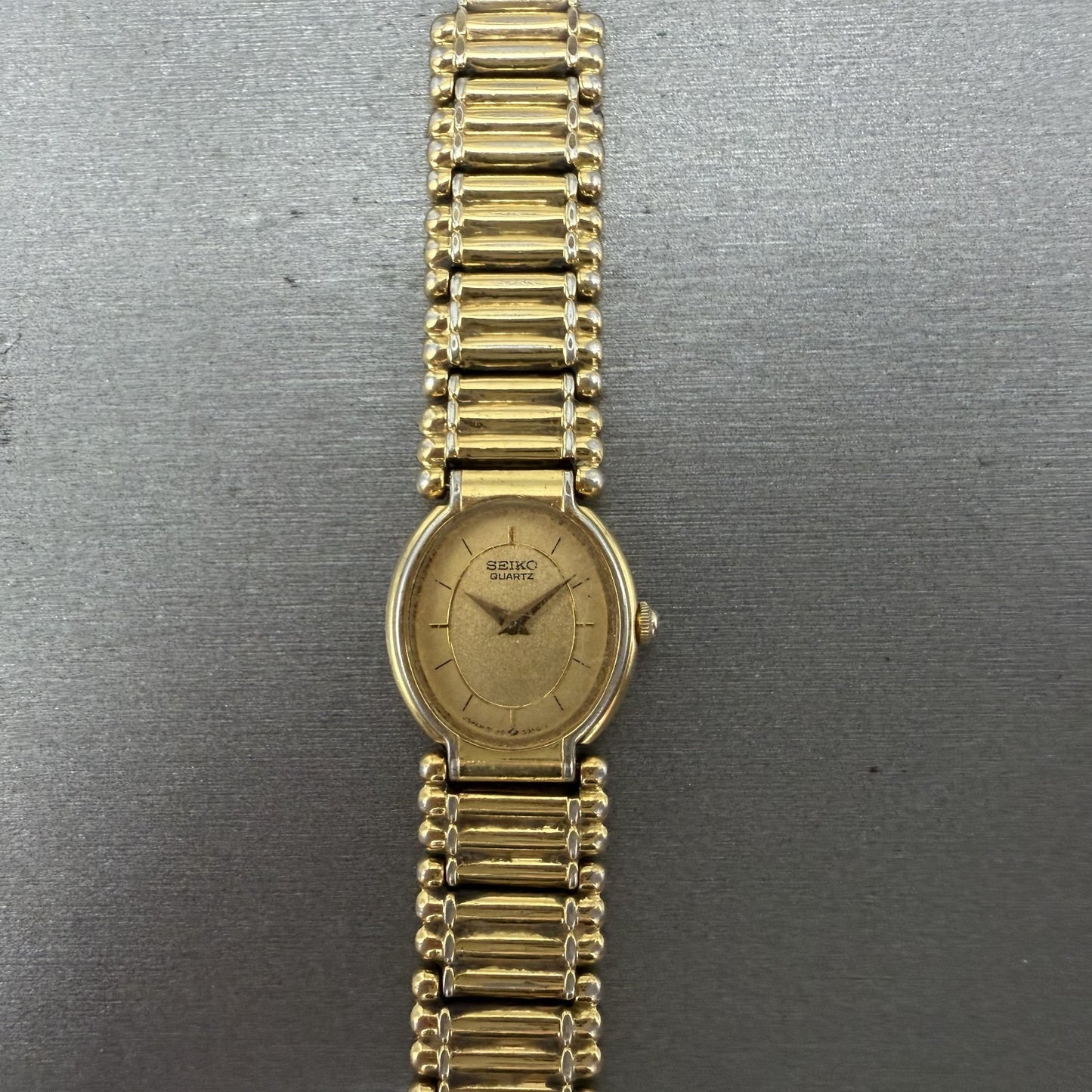 Seiko Watch Women 18mm Gold Dial Gold Tone Oval BROKEN BAND 2P205E29 New Batt0