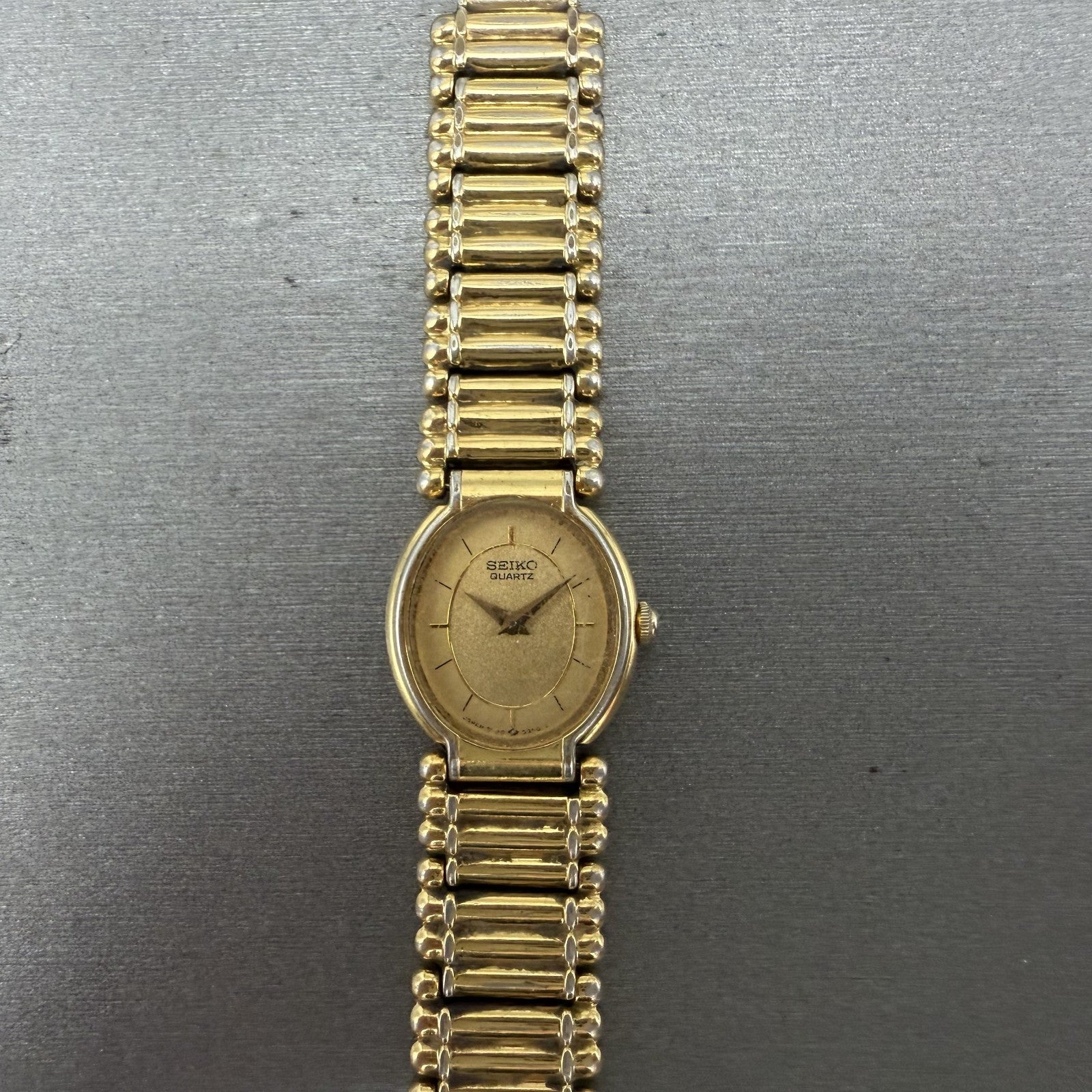 Seiko Watch Women 18mm Gold Dial Gold Tone Oval BROKEN BAND 2P205E29 New Batt0