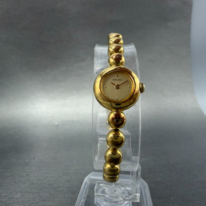 Seiko Watch Women 14mm Champagne Dial Gold Tone Round 1E20-0070 New Battery5