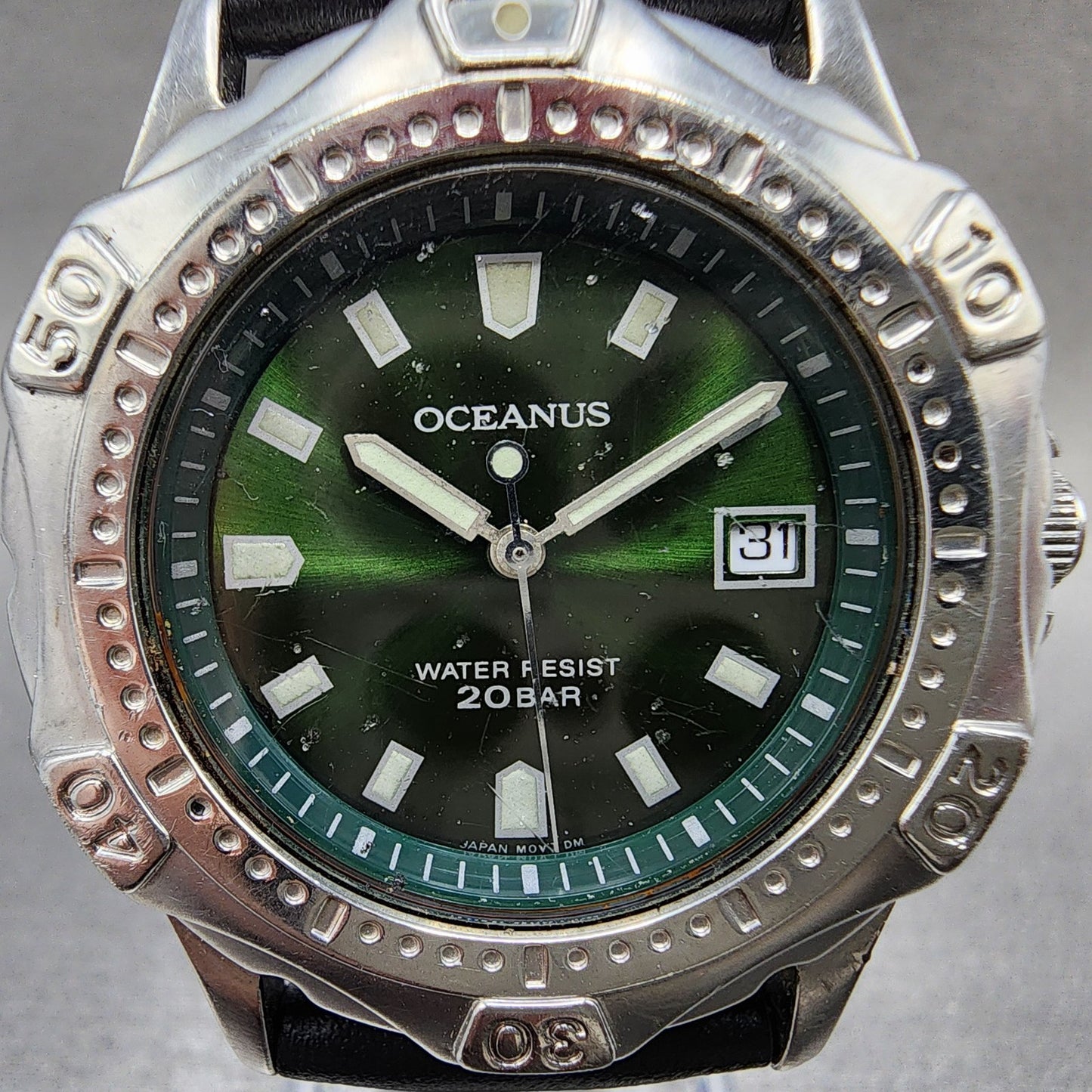 Oceanus water resistant stainless steel wristwatch with green dial and date display