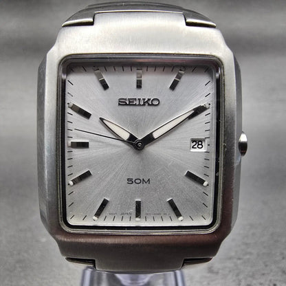 Seiko Watch Men 32mm Silver Dial Silver Tone Date Rectangle 7N32-0AL0 New Batt1
