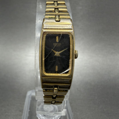 Seiko Tank Watch Women 13mm Black Dial Gold Tone Rectangle 2E206579 New Battery0