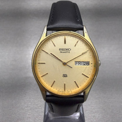 Seiko SQ Watch Men 32mm Champagne Dial Gold Tone Daydate Round 8223-70S9 New Bat0