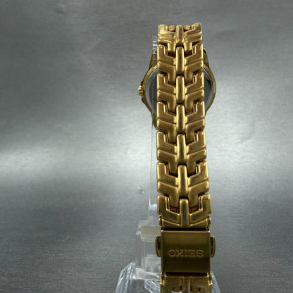 Seiko Watch Women 26mm Silver Dial Gold Tone Date Round 7N82-0AM0 New Battery7